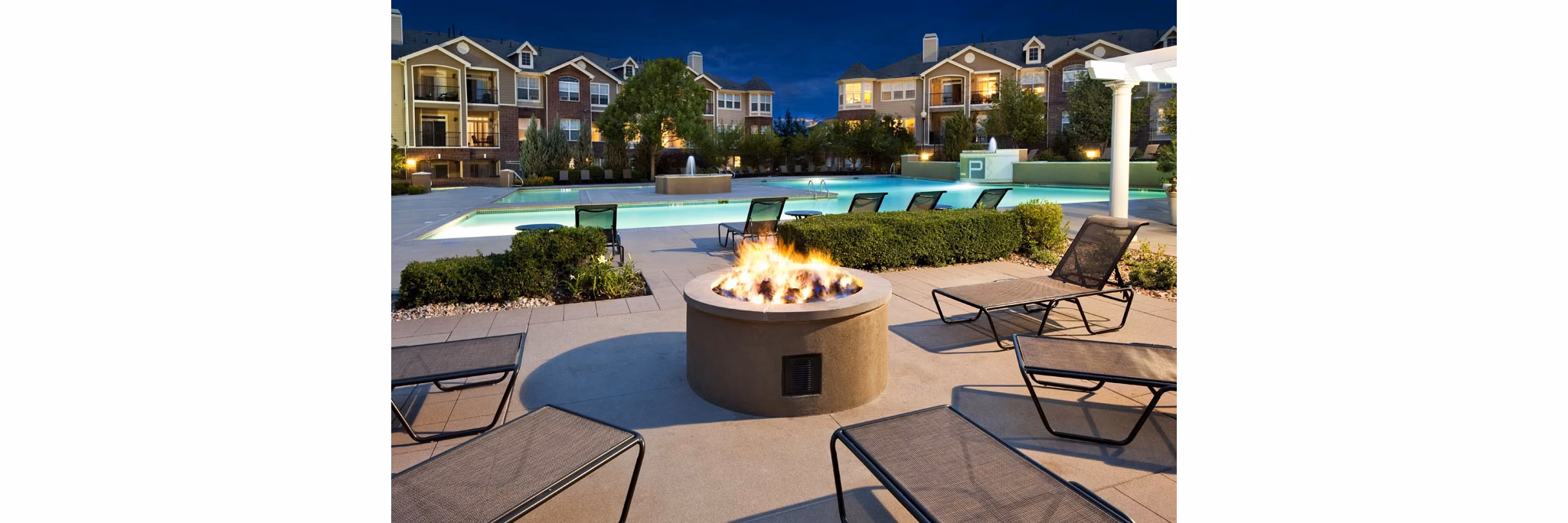 Cozy recreational area with firepit at Lowry Park Apartments