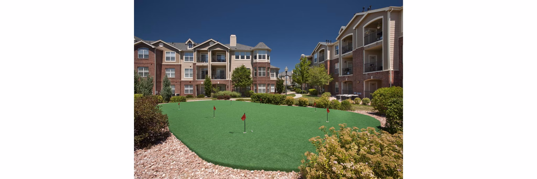 Putting green at Lowry Park Apartments offering recreational space for residents