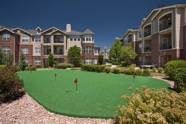 Putting green at Lowry Park Apartments offering recreational space for residents