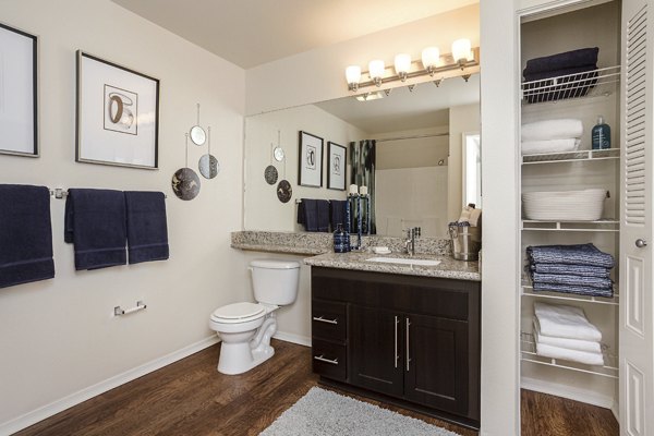 Bathroom featuring sleek fixtures and marble countertops at City Place Apartments, luxury living by Greystar