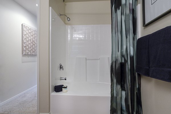 Bathroom with marble countertop and modern fixtures in City Place Apartments