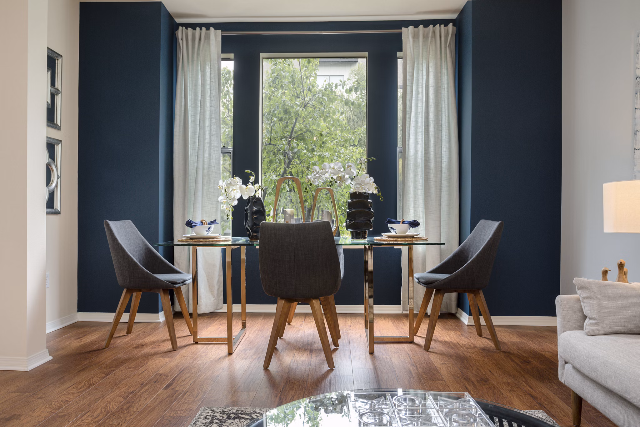 Dining area with modern furnishings and elegant lighting in City Place Apartments