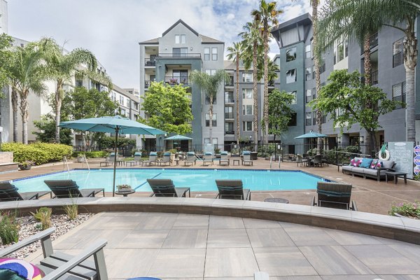 City Place Apartments: Modern pool with sun deck for residents' relaxation