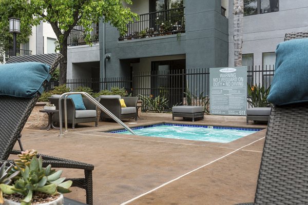 Relax in the outdoor hot tub at City Place Apartments, a Greystar community