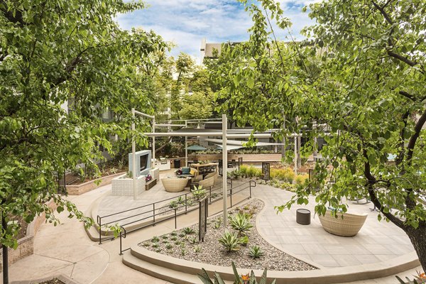 City Place Apartments: Tranquil courtyard with lush greenery and seating areas, offering a serene retreat for residents in a luxury setting