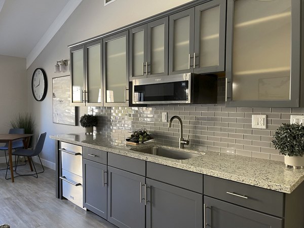 Modern clubhouse featuring stylish lounge and pool table at Aspen Ridge Apartments
