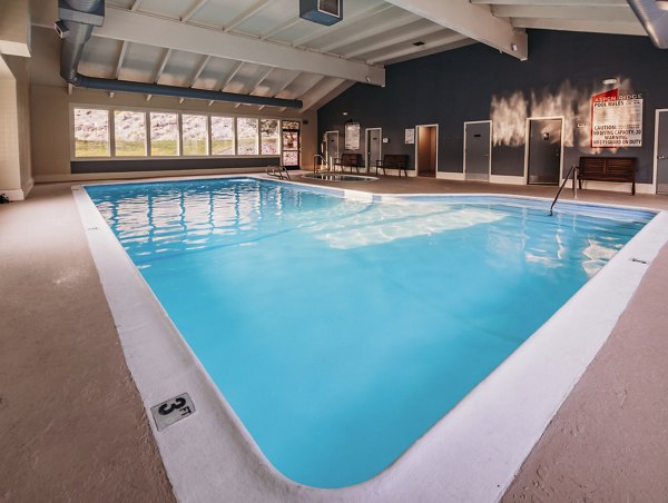 Indoor pool with lounge chairs at Aspen Ridge Apartments, a Greystar luxury residence offering premium amenities