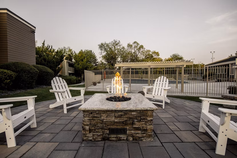 Fire pit at Aspen Ridge Apartments offering cozy outdoor seating and luxury evenings for residents