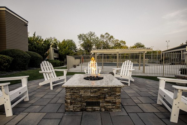 Fire pit at Aspen Ridge Apartments offering cozy outdoor seating and luxury evenings for residents
