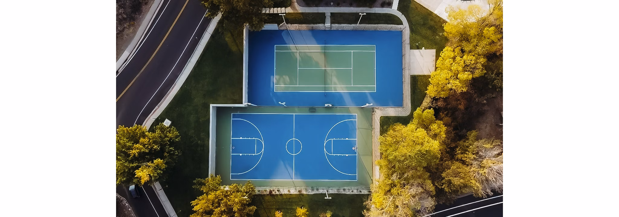 Aspen Ridge: Scenic view of luxury apartments surrounded by lush greenery