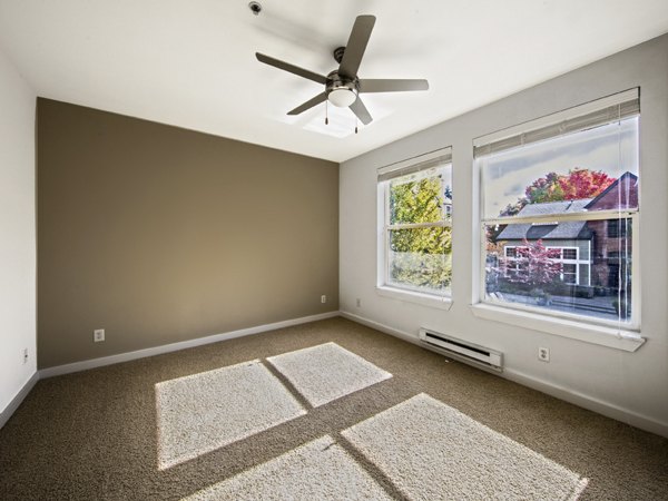 Spacious bedroom featuring a plush king bed at Lions Gate North Apartments
