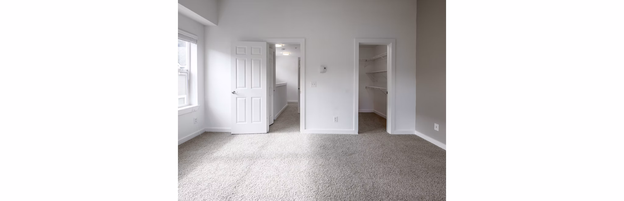 Bedroom with modern decor and plush bedding at Lions Gate North Apartments