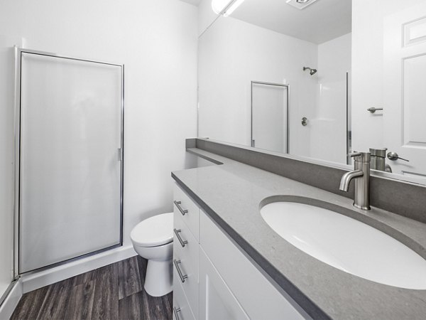 Bathroom featuring modern fixtures and marble accents at Lions Gate North Apartments