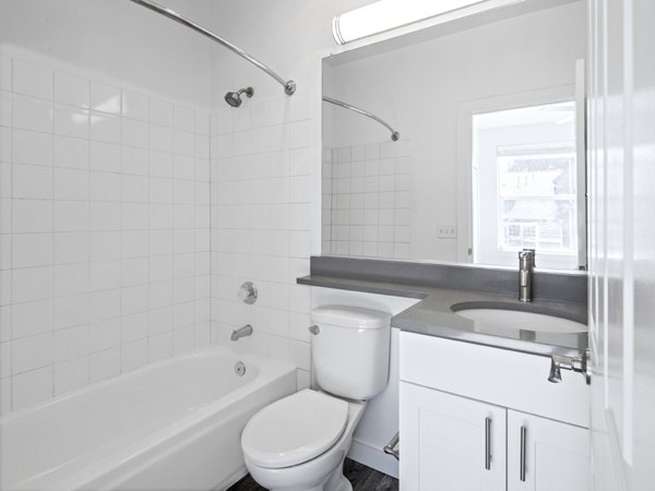 Modern bathroom with sleek fixtures and elegant tilework at Lions Gate North Apartments