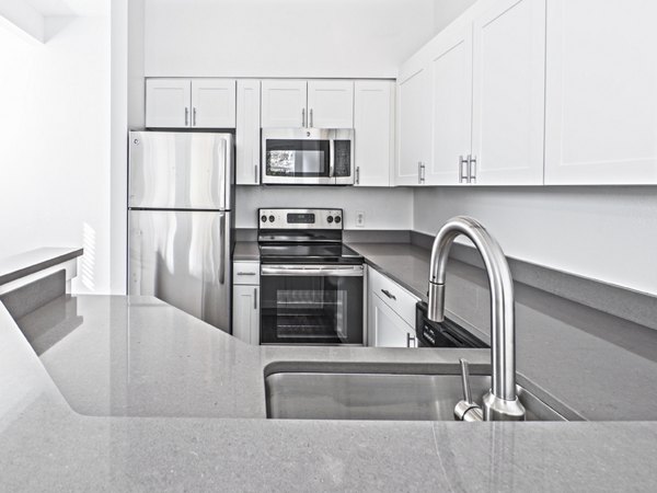 Kitchens featuring modern appliances at Lions Gate North Apartments