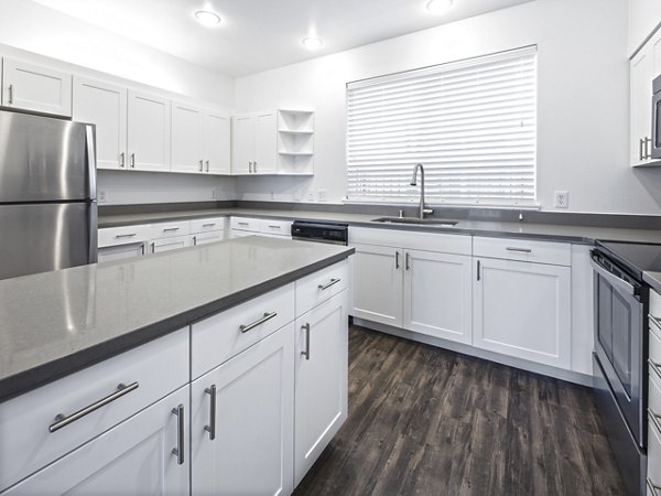 Spacious gourmet kitchen with stainless steel appliances at Lions Gate North Apartments