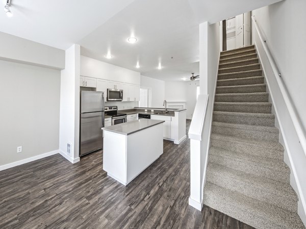 Modern kitchen with stainless steel appliances at Lions Gate North Apartments