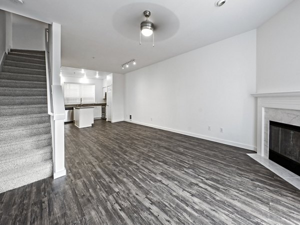 Spacious living room with modern decor in Lions Gate North Apartments, perfect for stylish urban living