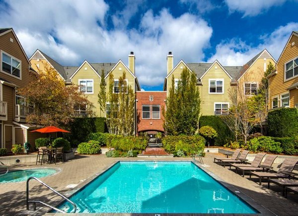 Rooftop pool with loungers at Lions Gate North Apartments, offering panoramic city views and luxury living
