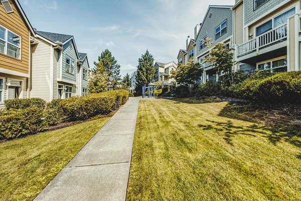 Bella Vista Apartments: Elegant courtyard with lush greenery and seating areas, perfect for relaxation and gatherings