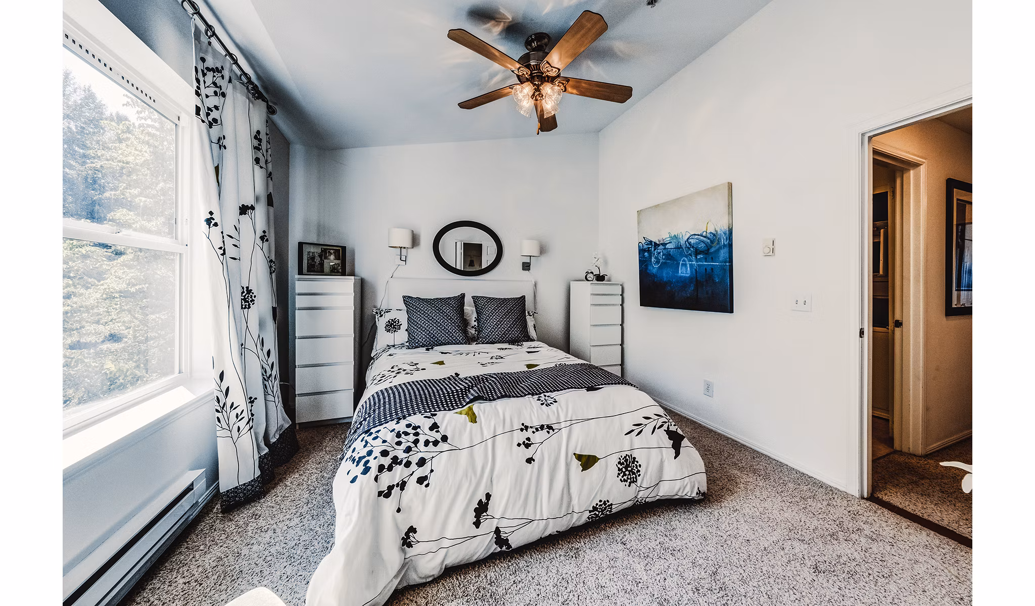 Elegant bedroom with modern furnishings at Bella Vista Apartments