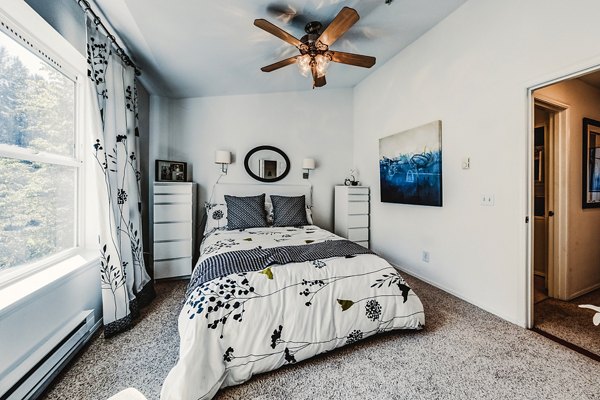 Elegant bedroom with modern furnishings at Bella Vista Apartments
