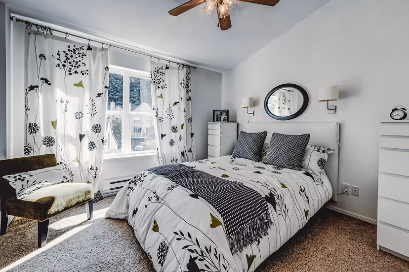 Cozy bedroom with modern decor in Bella Vista Apartments, offering luxury living at Greystar's high-end community