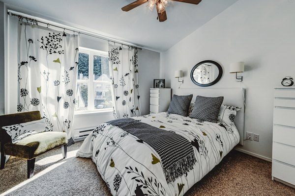Cozy bedroom with modern decor in Bella Vista Apartments, offering luxury living at Greystar's high-end community