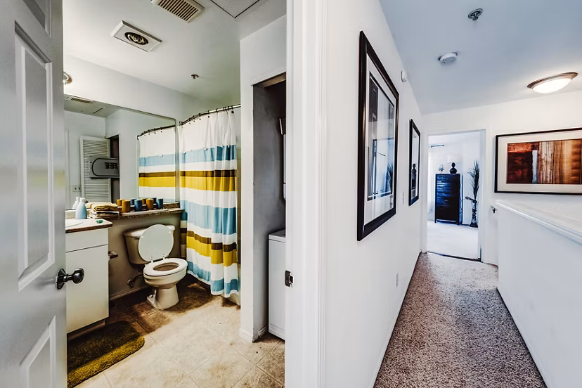 Bathroom featuring modern fixtures and elegant tilework at Bella Vista Apartments