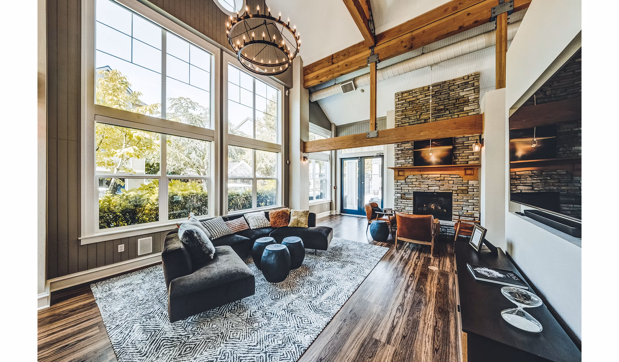Clubhouse lounge with modern decor at Bella Vista Apartments, featuring ample seating and elegant design elements for luxury living