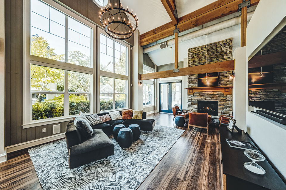 Clubhouse lounge with modern decor at Bella Vista Apartments, featuring ample seating and elegant design elements for luxury living
