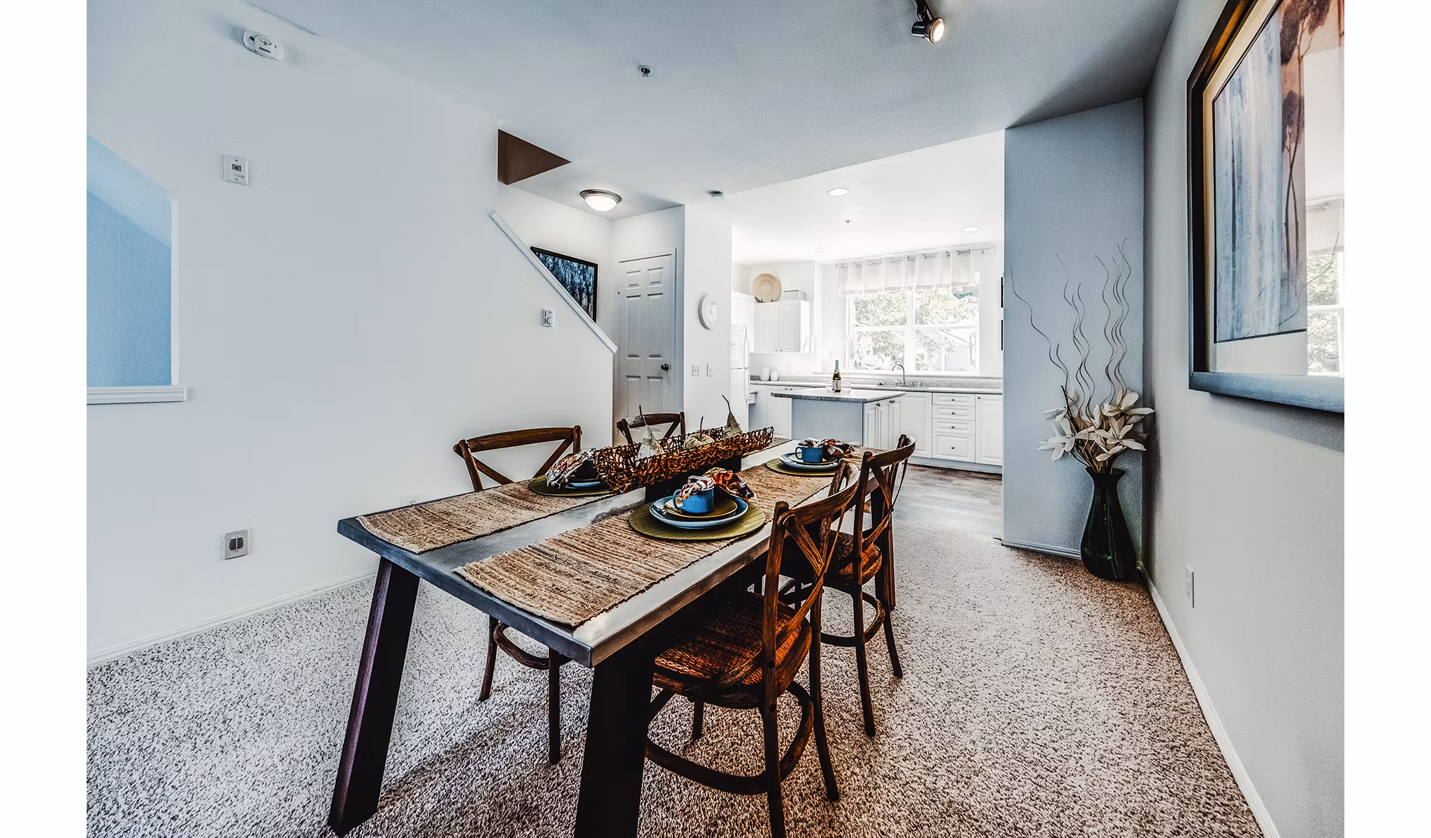 Dining room featuring elegant lighting and modern decor in Bella Vista Apartments