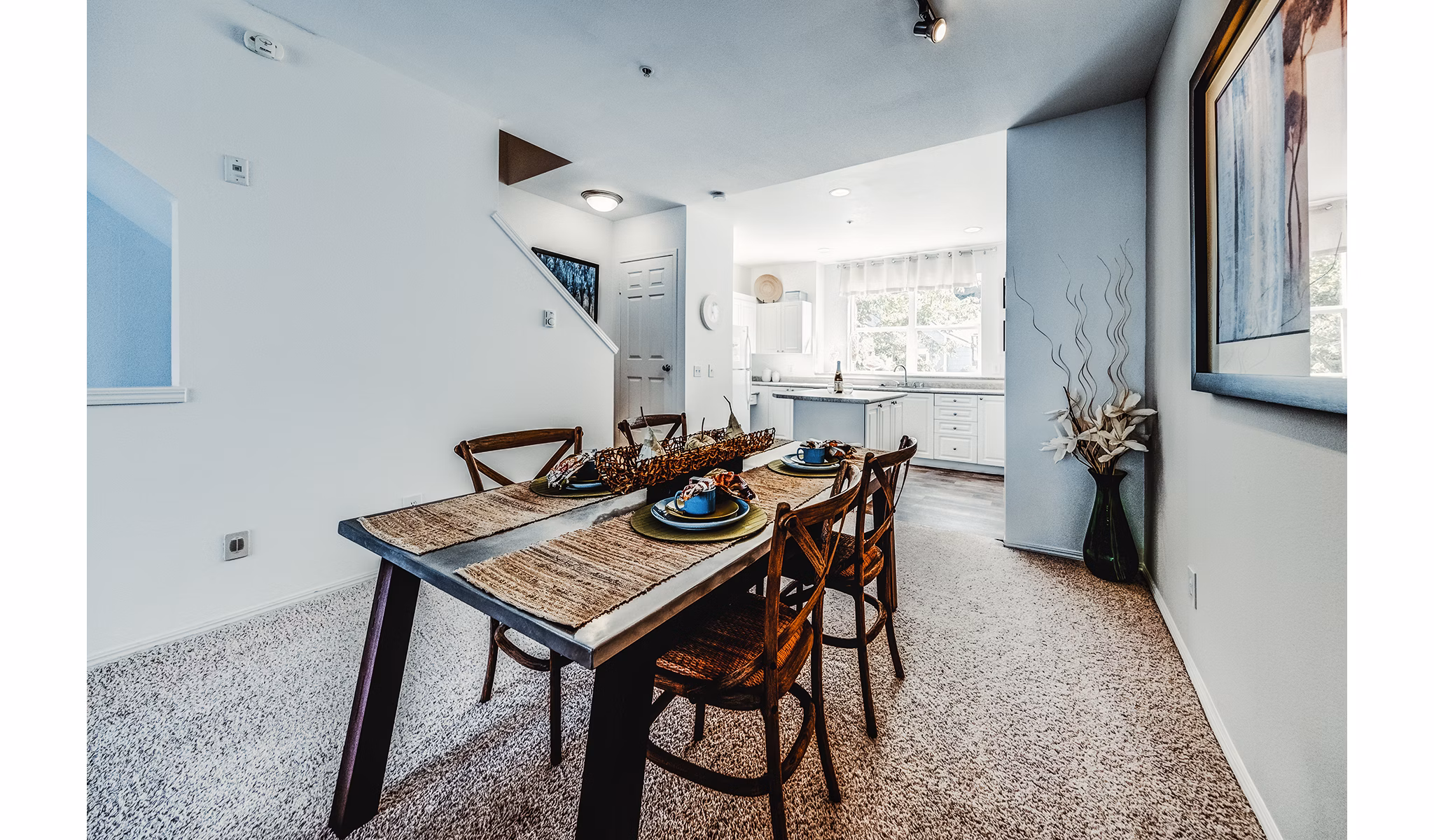 Dining room featuring elegant lighting and modern decor in Bella Vista Apartments