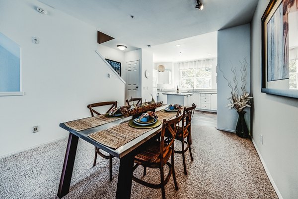 Dining room featuring elegant lighting and modern decor in Bella Vista Apartments