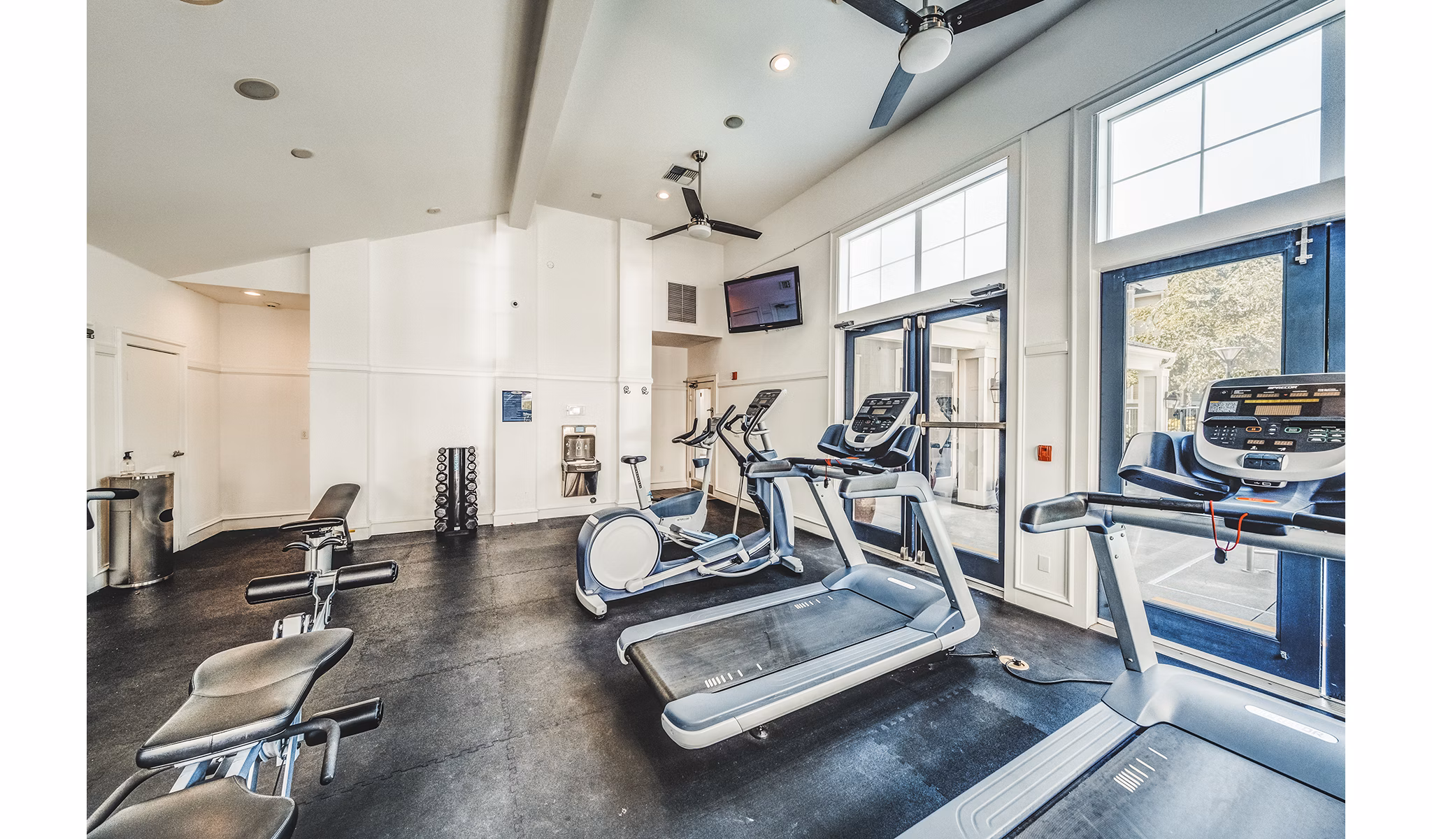 Modern fitness center with state-of-the-art equipment at Bella Vista Apartments, promoting health and wellness for residents