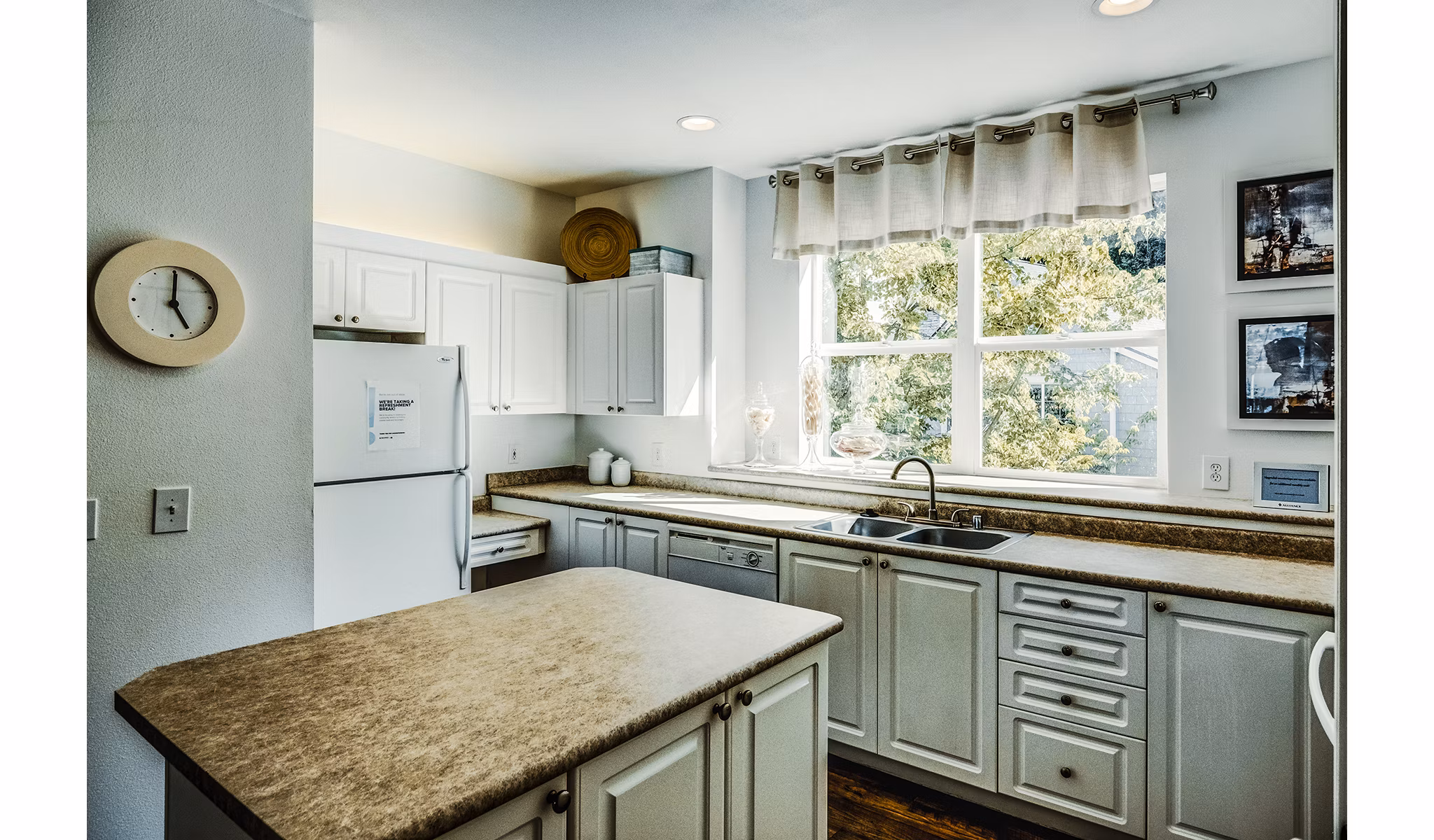 Modern kitchen with stainless steel appliances in Bella Vista luxury apartments