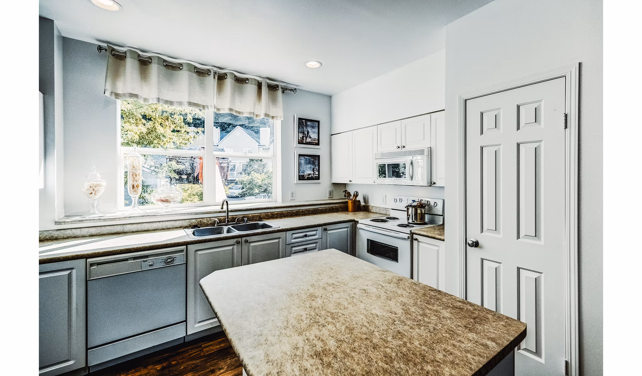 Modern kitchen with stainless steel appliances at Bella Vista Apartments