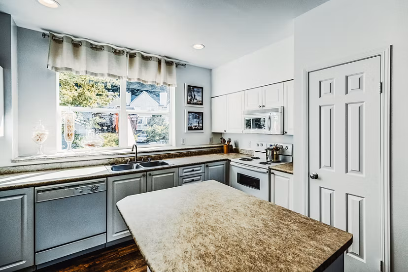 Modern kitchen with stainless steel appliances at Bella Vista Apartments