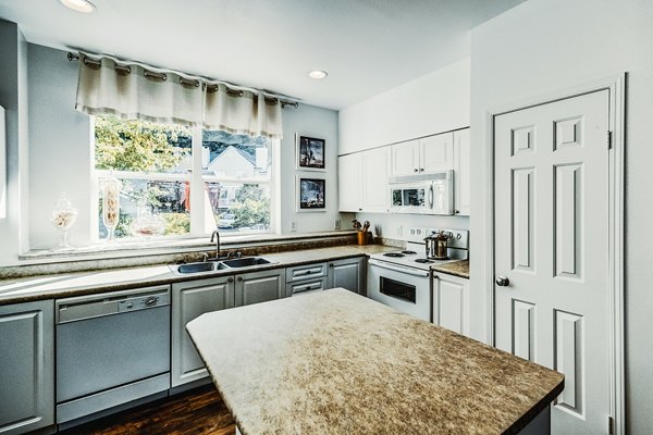 Modern kitchen with stainless steel appliances at Bella Vista Apartments