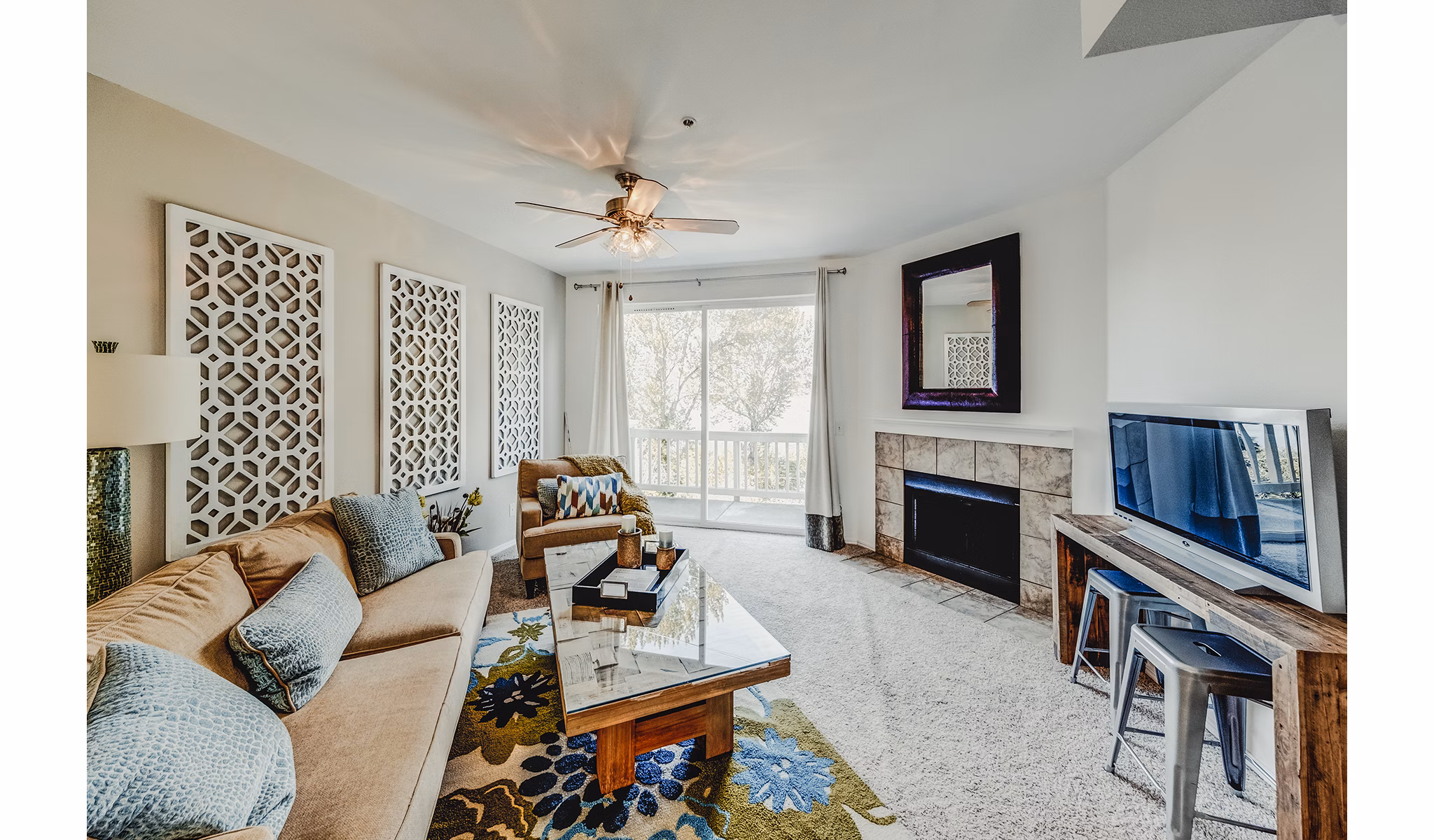 Bella Vista Apartments: Modern living room with chic decor and large windows offering natural light