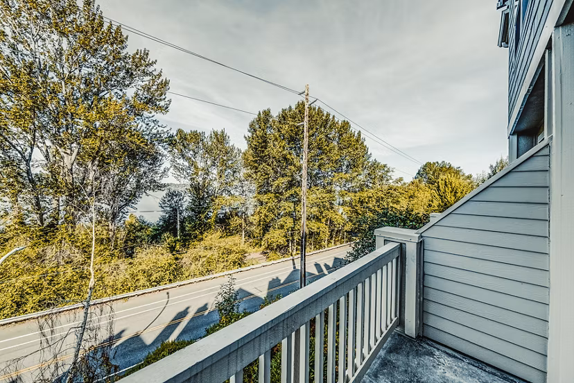 Bella Vista Apartments: Cozy patio area with scenic views, ideal for relaxing outdoors in a luxury setting