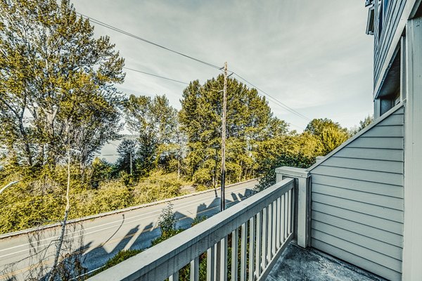 Bella Vista Apartments: Cozy patio area with scenic views, ideal for relaxing outdoors in a luxury setting
