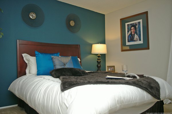 Bedroom featuring plush bedding and modern decor at La Terraza Apartments