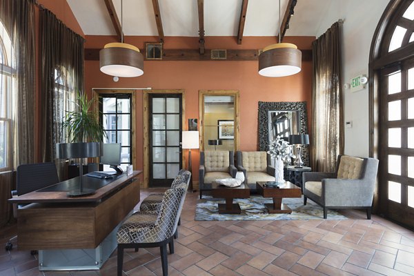 La Terraza Apartments: Modern clubhouse with cozy seating and entertainment space