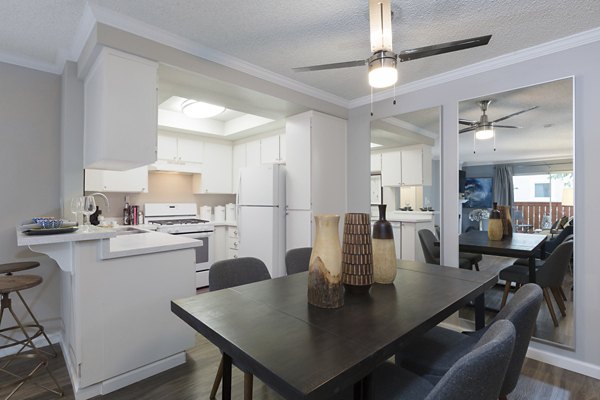 Dining area with modern decor and ample seating at La Terraza Apartments