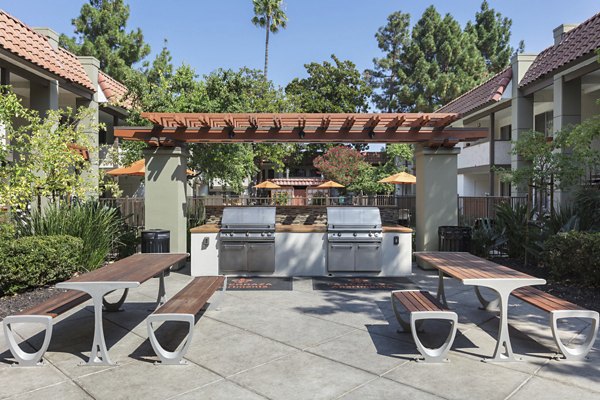 Grill area with outdoor seating at La Terraza Apartments