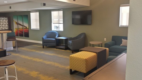 Clubhouse featuring modern interiors and cozy seating at Axiom La Jolla Apartments