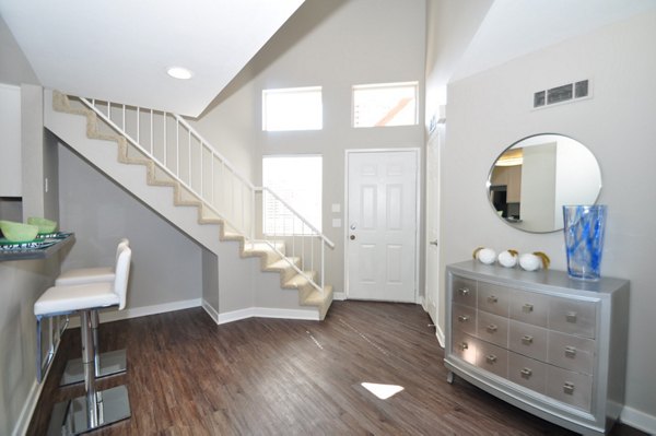 Elegant kitchen with stainless steel appliances and marble countertops in Axiom La Jolla Apartments