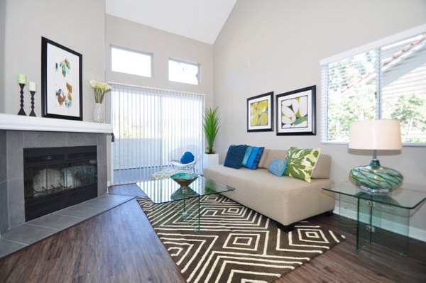 Spacious living room with contemporary furnishings at Axiom La Jolla Apartments