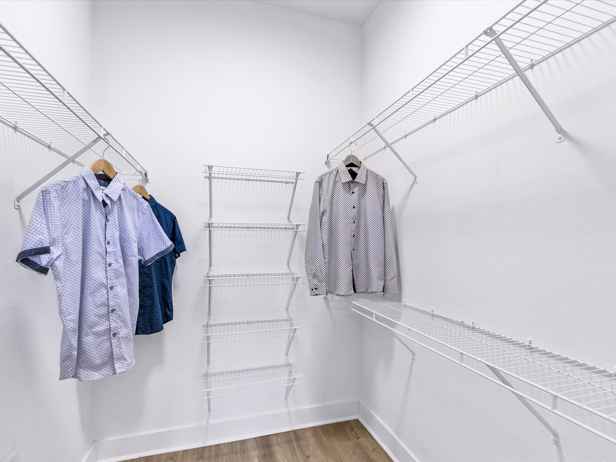 Spacious bedroom closet with built-in storage at Ambrose Apartments